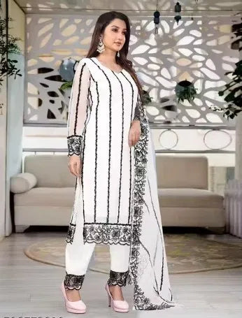 White rayon kurti set with black ethnic embroidery, sheer sleeves, and elegant design.