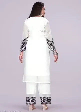 Premium white rayon kurti set with black ethnic embroidery on sleeves and pants, elegant design