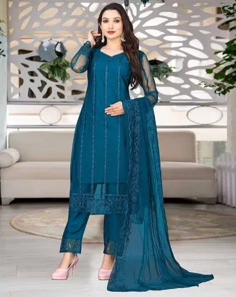 Woman wearing premium teal rayon kurti set with sheer dupatta and intricate ethnic design