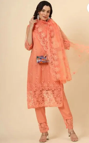 Woman wearing peach embroidered ethnic suit with premium sheer fabric and floral details.
