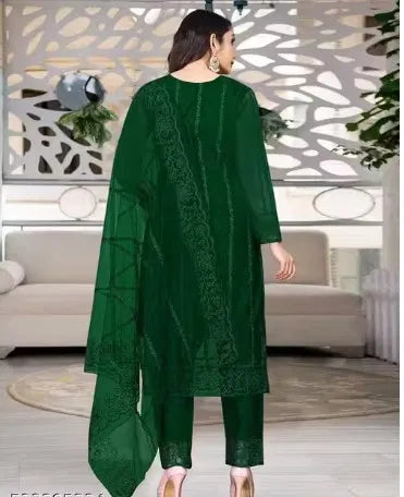 Woman wearing premium green rayon kurti set with intricate ethnic patterns, elegant and comfortable.