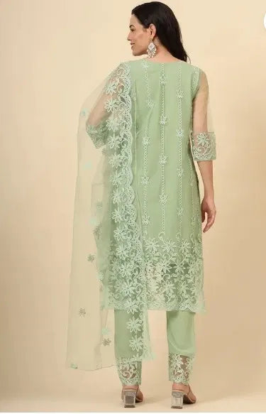 Woman in pastel green ethnic suit with sheer floral embroidered dupatta, premium fabric quality