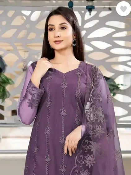 Woman in premium purple ethnic suit with sheer dupatta, floral embroidery, elegant fabric