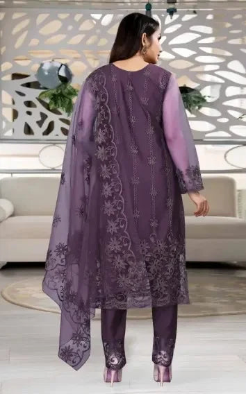 Woman in premium purple ethnic suit with sheer embroidered dupatta and floral design