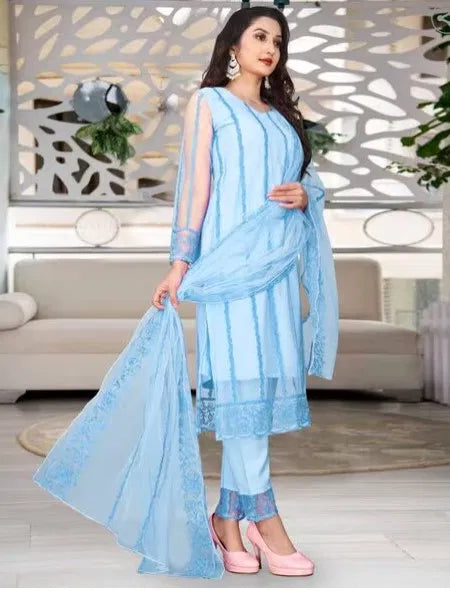 Woman wearing premium light blue rayon kurti set with sheer dupatta and ethnic embroidery