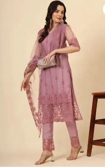 Woman in premium mauve ethnic suit with sheer embroidered fabric and elegant floral design
